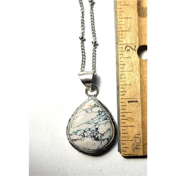 29)  PEAR SHAPED, BEZEL SET NATURAL WHITE