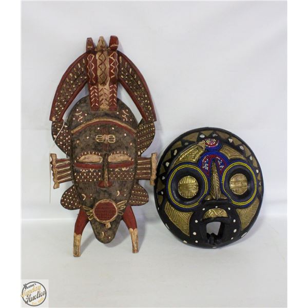TWO AFRCAN CARVED WOOD MASKS