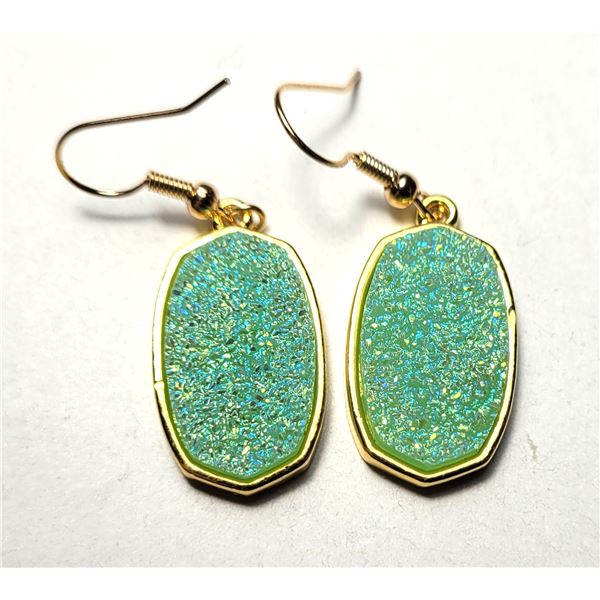34)  GOLD TONE WITH PALE GREEN PEBBLE