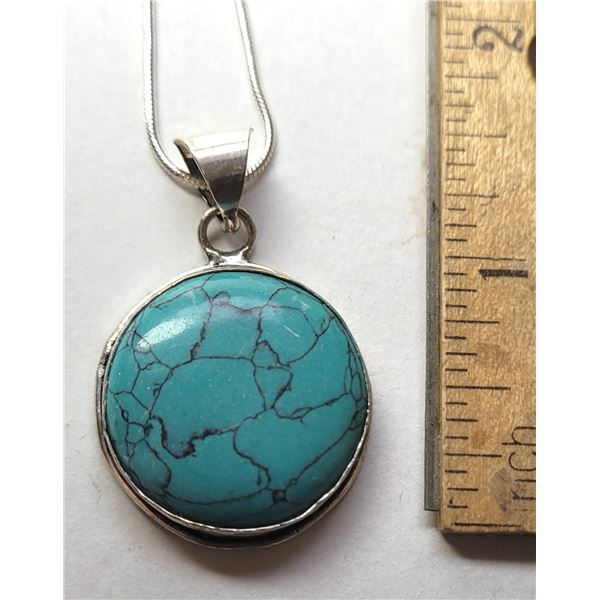 21)  NATURAL ROUND BEZEL SET TOURQUOISE