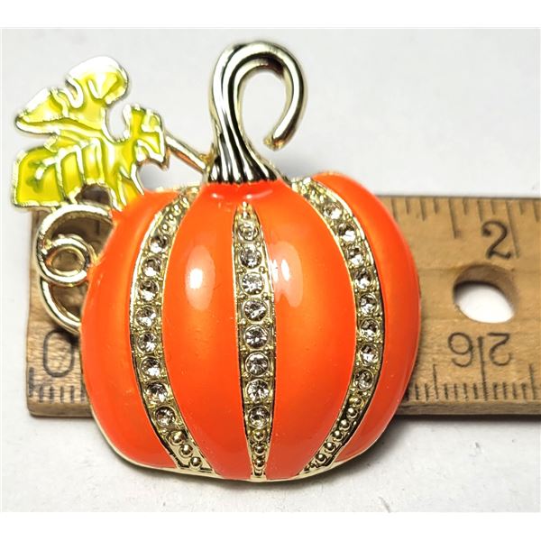 16)  ORANGE ENAMEL WITH CLEAR CRYSTALS,