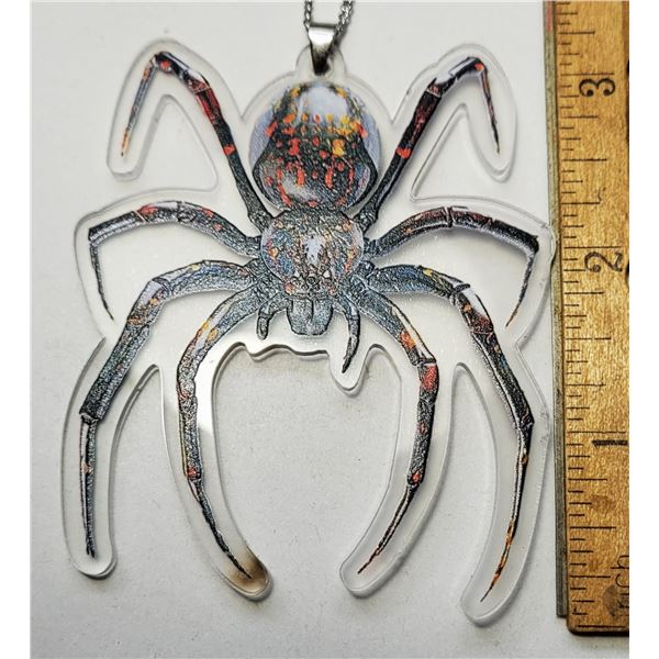 26)  LUCITE SPIDER PENDANT ON 18" CHAIN.