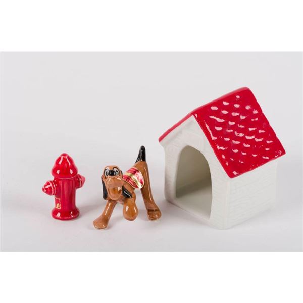 A 1940s Pluto and Red Doghouse Figurine Set.