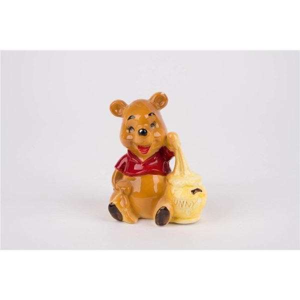 A Winnie the Pooh Ceramic Figurine by Enesco.
