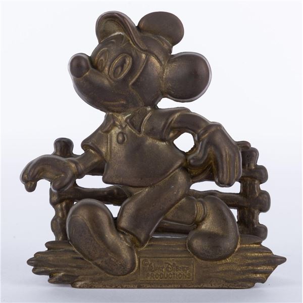 A Mickey Mouse Souvenir Brass Napkin Holder.