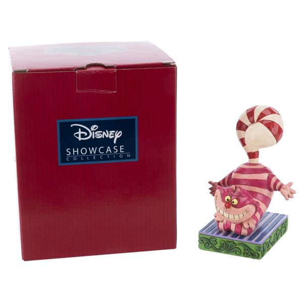 A Jim Shore Cheshire Cat"Candy Cane Cheer" Figurine.