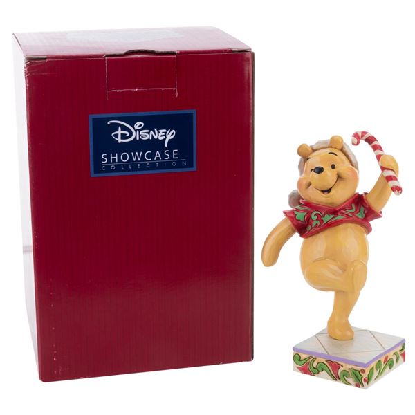 A Jim Shore Winnie the Pooh"Christmas Sweetie" Figurine.