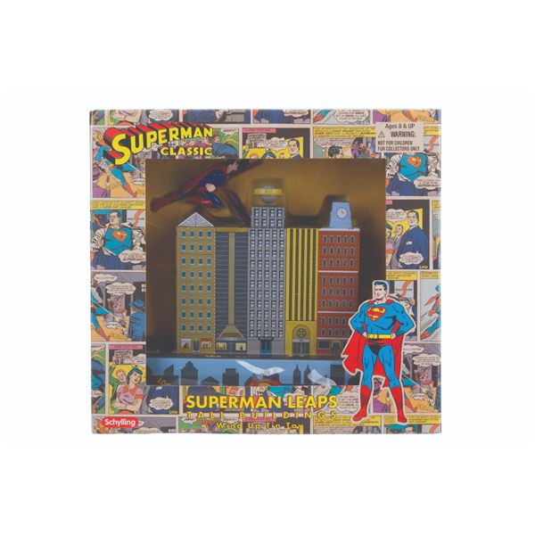 A Superman Leaps Tall Buildings Wind Up Tin Toy.