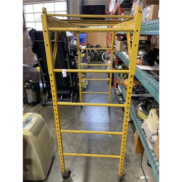 YELLOW ROLLING SCAFFOLD SECTION, 29 X 74 INCH, HAS DECKING FRAME NO WOOD