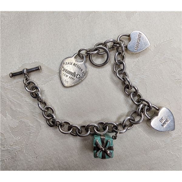 Tiffany & Co. SS charm bracelet with three charms