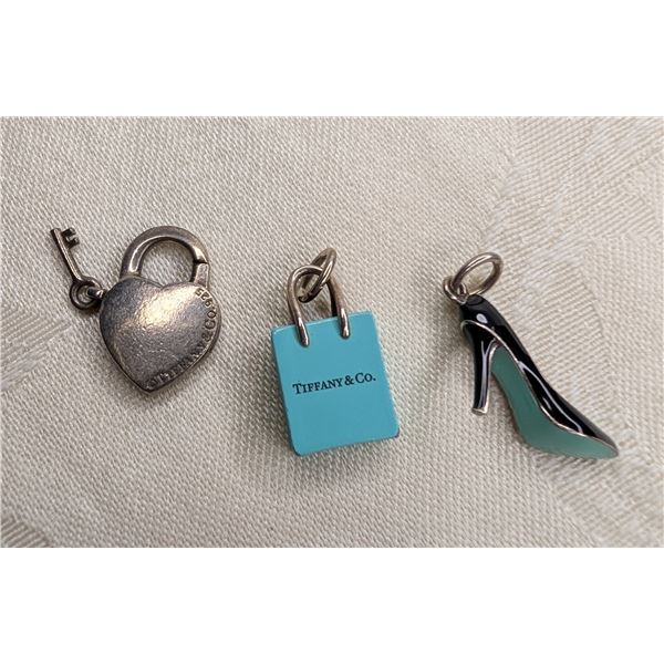 Tiffany and Co set of three charms - padlock heart with key, blue enamel shopping bag and black enam