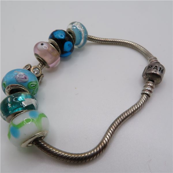 PANDORA bracelet with 7 charms, marked 925