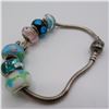 Image 1 : PANDORA bracelet with 7 charms, marked 925