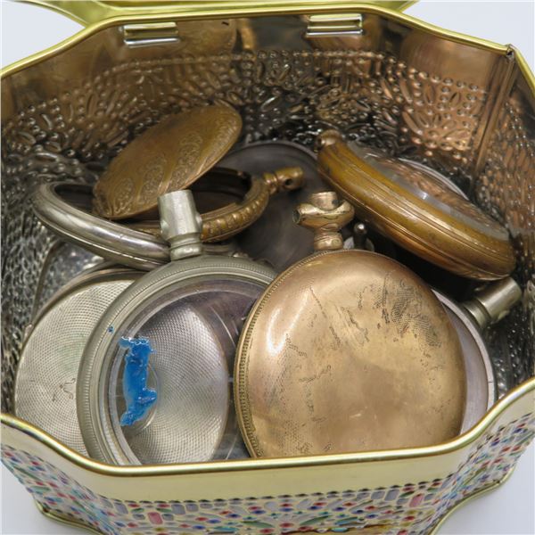 Tin of vintage pocket watch parts.  Various fronts and backs of pocket watches.