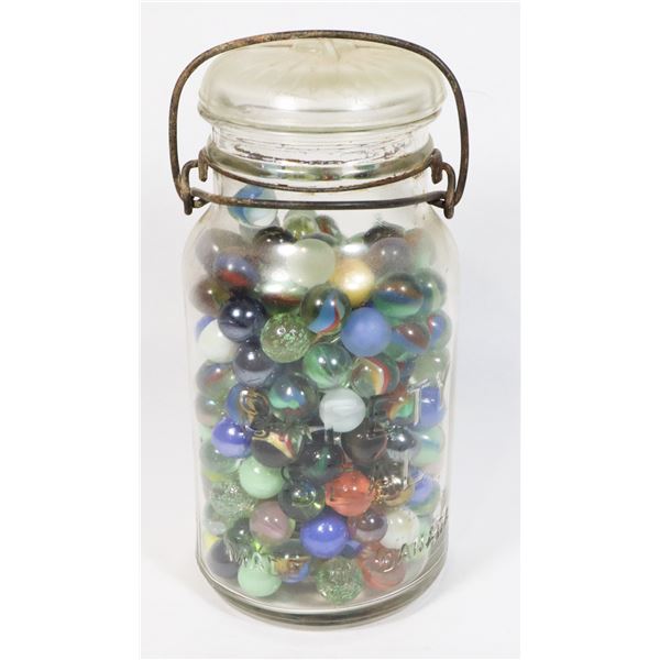 VINTAGE CANADA GLASS JAR FULL OF MARBLES