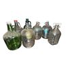 Image 1 : Shelf of assorted vintage glass jugs