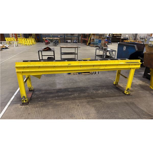 YELLOW METAL INDUSTRIAL CYLINDER CONVEYER TABLE APPROX 9'L X 2'W X 3.3'H