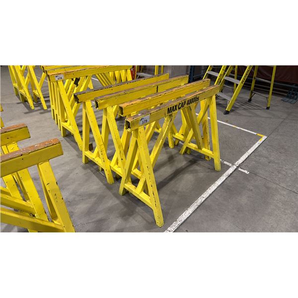 GROUP OF 4 YELLOW METAL HEAVY DUTY SAW HORSES APPROX 4' L X 3' H