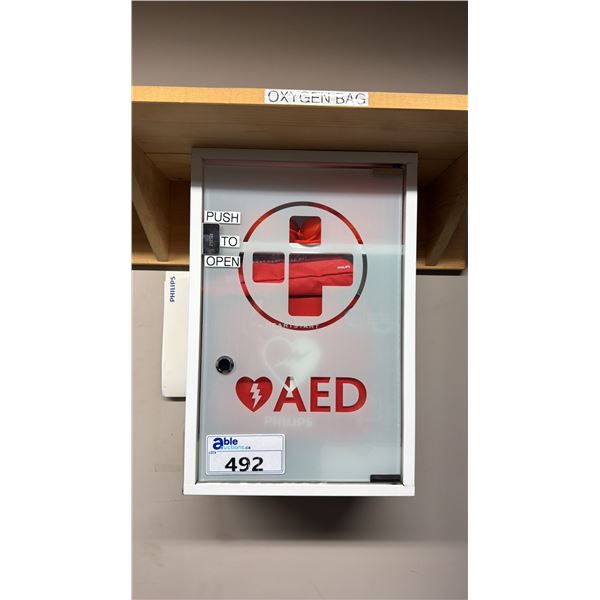 PHILIPS HEARTSTART ONSITE (M5066A) AED IN CASE WITH WALL MOUNT STORAGE CABINET