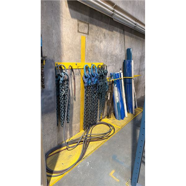 2 YELLOW WALL MOUNT HANGERS WITH ASSORTED LIFTING CHAINS, AIR HOSE, CLAMPS & METAL PIECES
