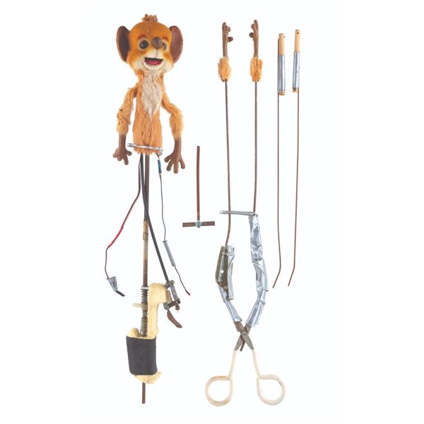 An "Adventures in Wonderland" Dormouse Puppet.