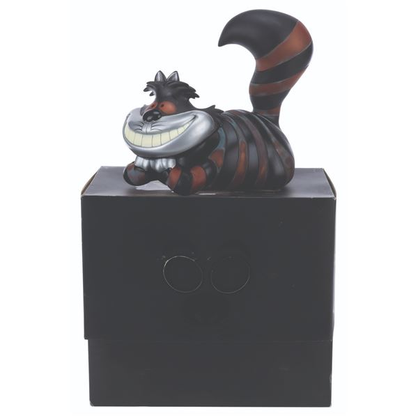 A Disney Vault Cheshire Cat Vinyl Figure.