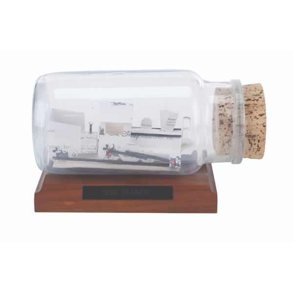 A Handmade Disney Business Card Train in a Bottle.