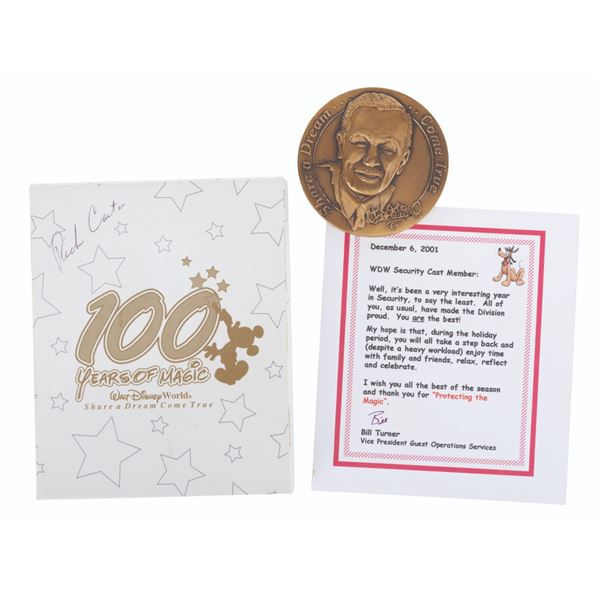 A Walt Disney World Cast Member 100 Years Medallion.