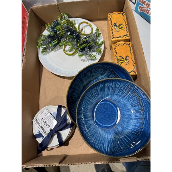 Dishes, napkin, rings, salt, and pepper shakers