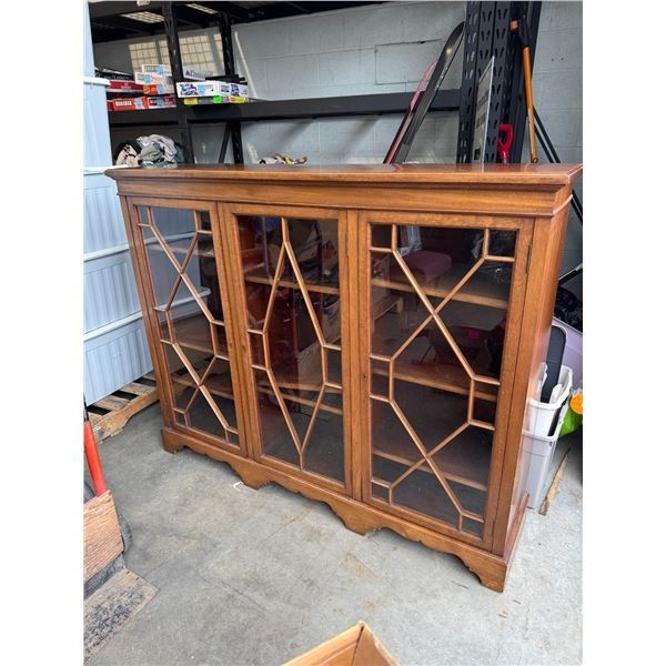 Display cabinet with key measures 5 feet long 15 inches deep 48 1/2 inches tall.