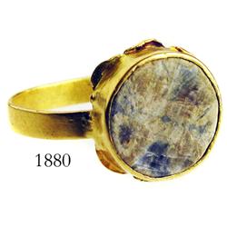 Gold ring with gray stone.