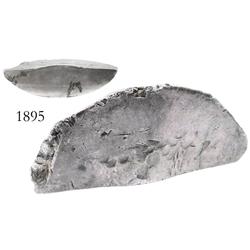 Pewter ingot cut in half.