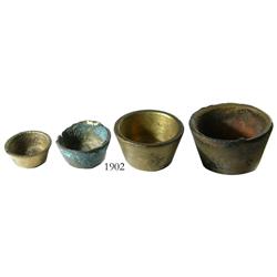 Set of 4 brass nested weights.