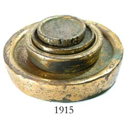 Set of 4 brass disk-type weights.