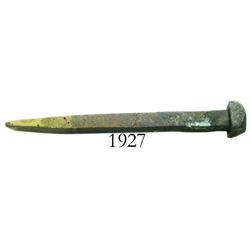 Small, brass spike.