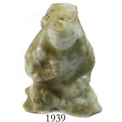 Small, porcelain figurine.