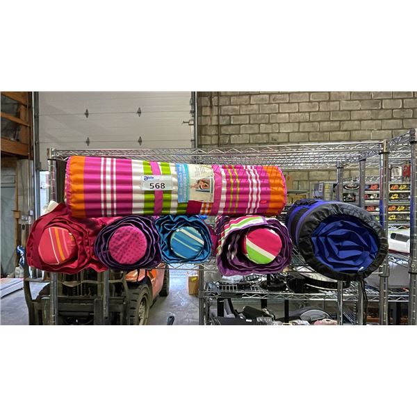 SHELF OF ROLL-UP BEACH MATS