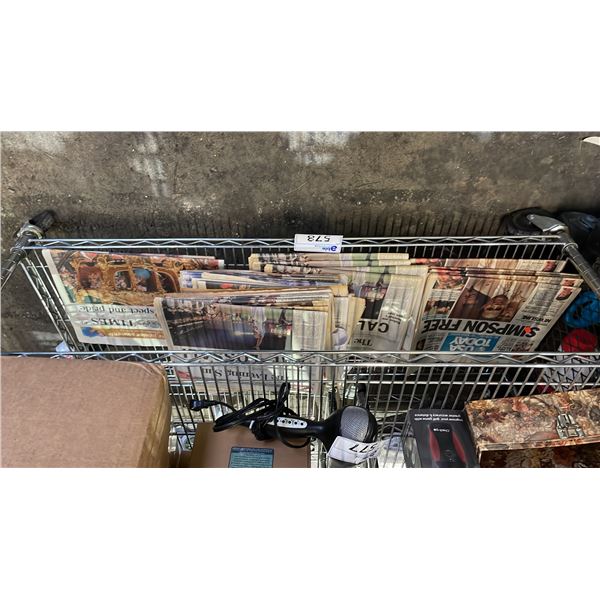 SHELF OF ASSORTED VINTAGE NEWSPAPERS