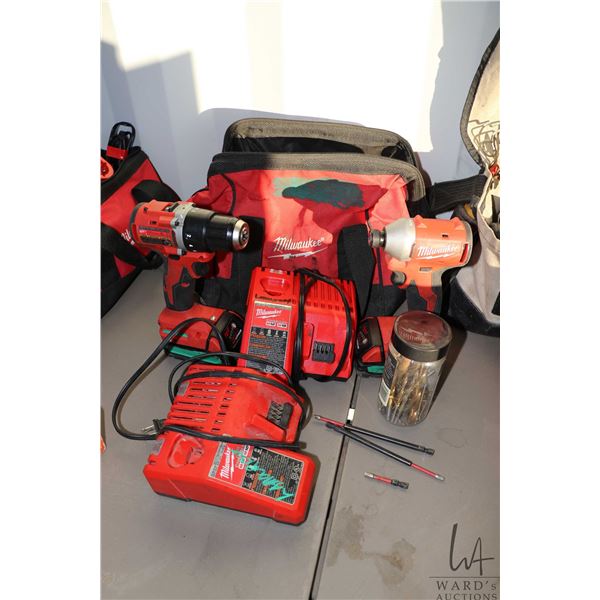 Milwaukee 18 volt drill and impact driver with bits, batteries and chargers in canvas carry bag