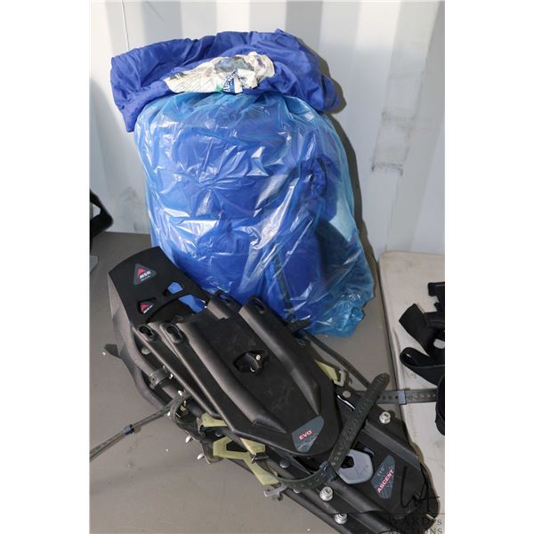 A pair of MSR EVO Ascent Snow shoes and a sleeping bag