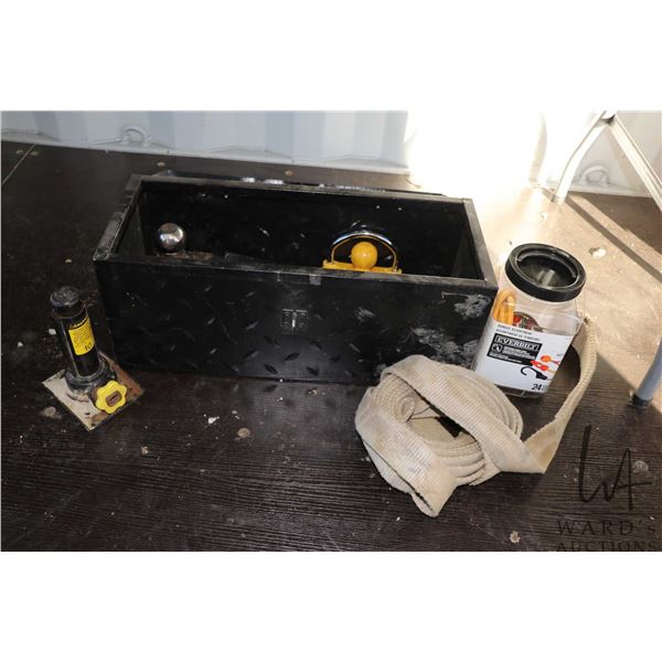 Small metal tool chest with latch including trailer hitches, spare trailer balls and pins, automotiv