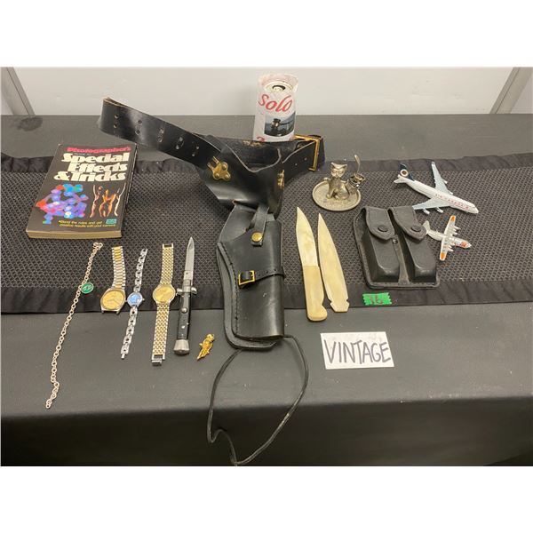 Lot of items including toy gun holster, fashion watches, knife cases and more
