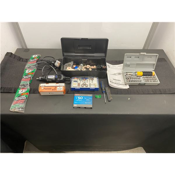 Dremel brand rotary tool with case of attachments, staples, finishing nails, driver bits, sockets an