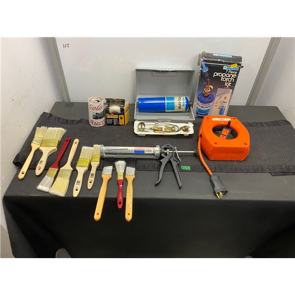 Lot of tools including paint brushes, propane torch and more