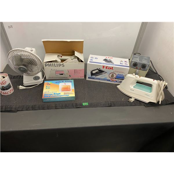 Lot of household appliances including desk fan, Phillips iron, T-Fal iron, portable electric heater