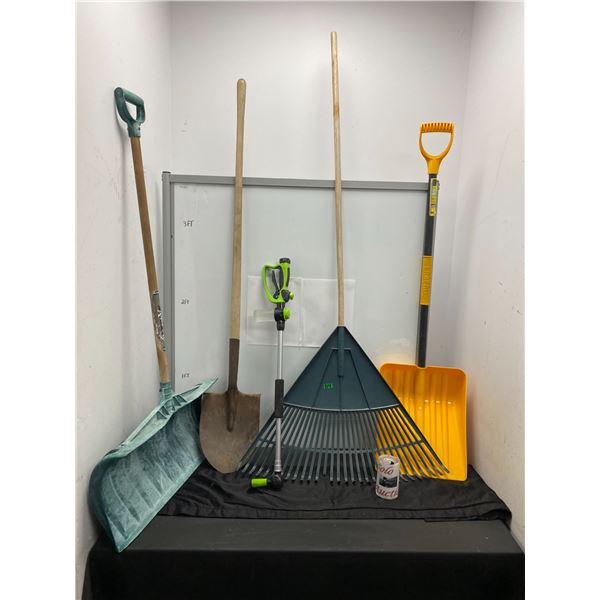 Lot of gardening tools including rake and shovels
