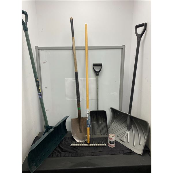 Lot of gardening tools including multiple shovels