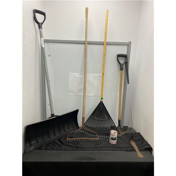 Lot of gardening tools including rake and shovels