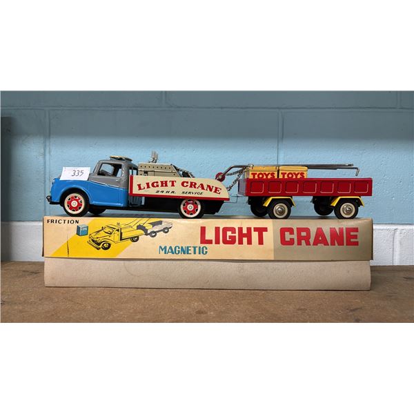 VINTAGE TIN FRICTION MAGNETIC LIGHT CRANE TOY