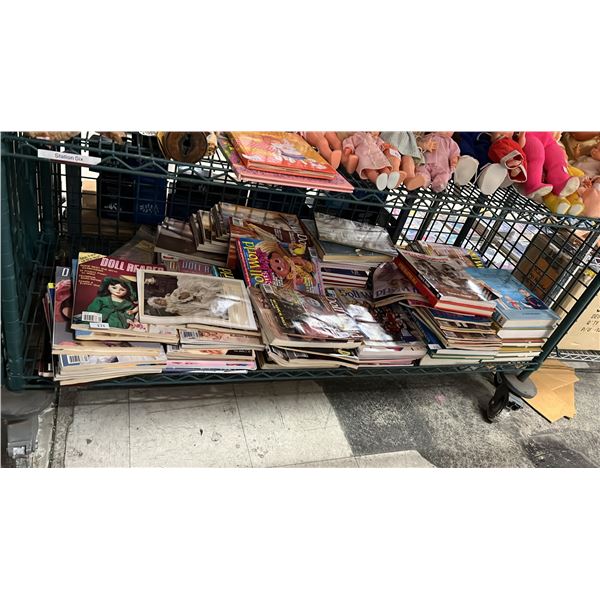 SHELF OF ASSORTED DOLL BOOKS